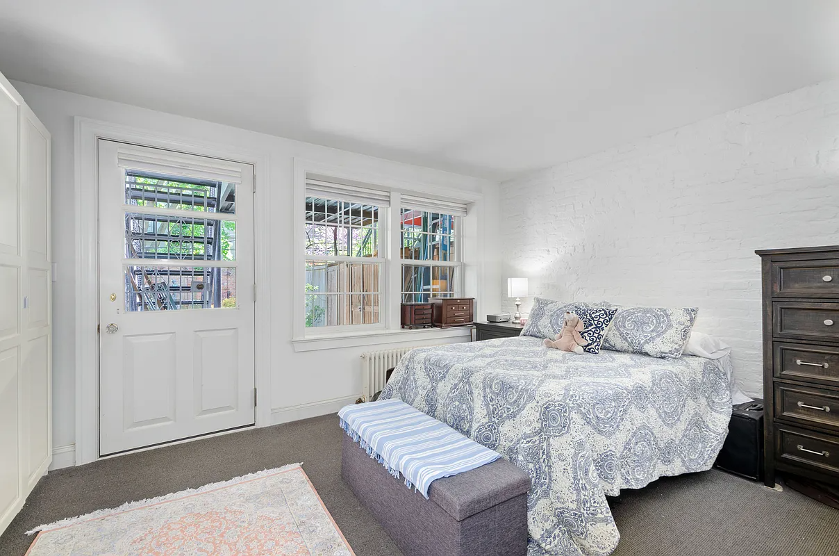 bedroom with door to rear yard