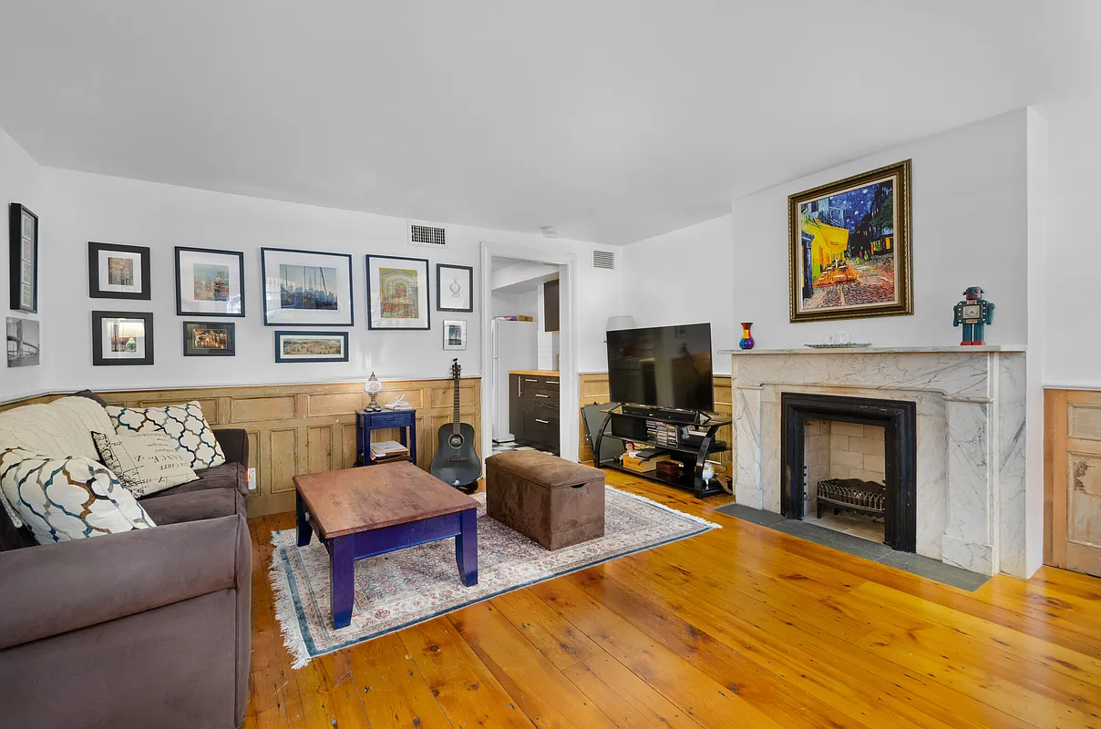 boerum hill living room with wainscoting, marble mantel
