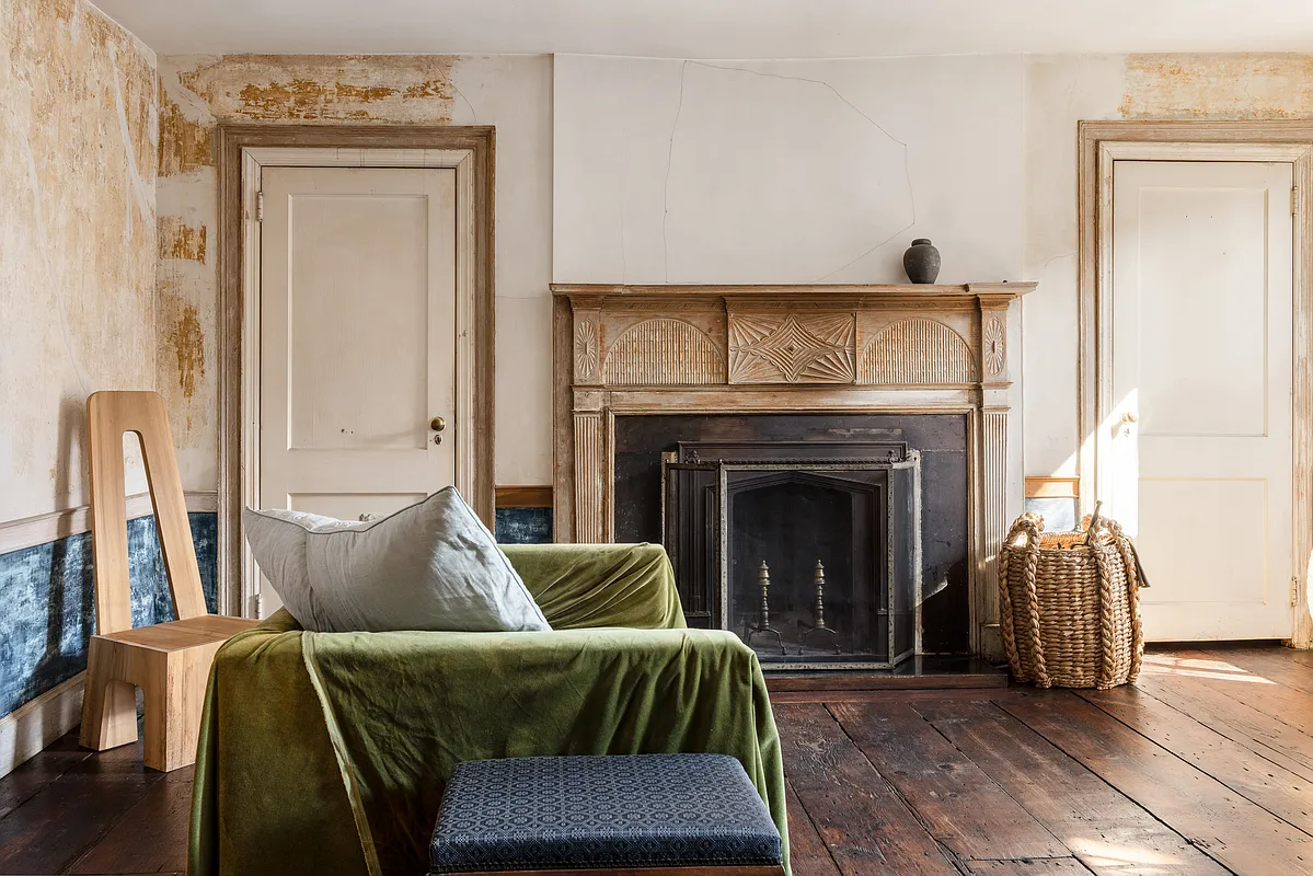 room with wood mantel