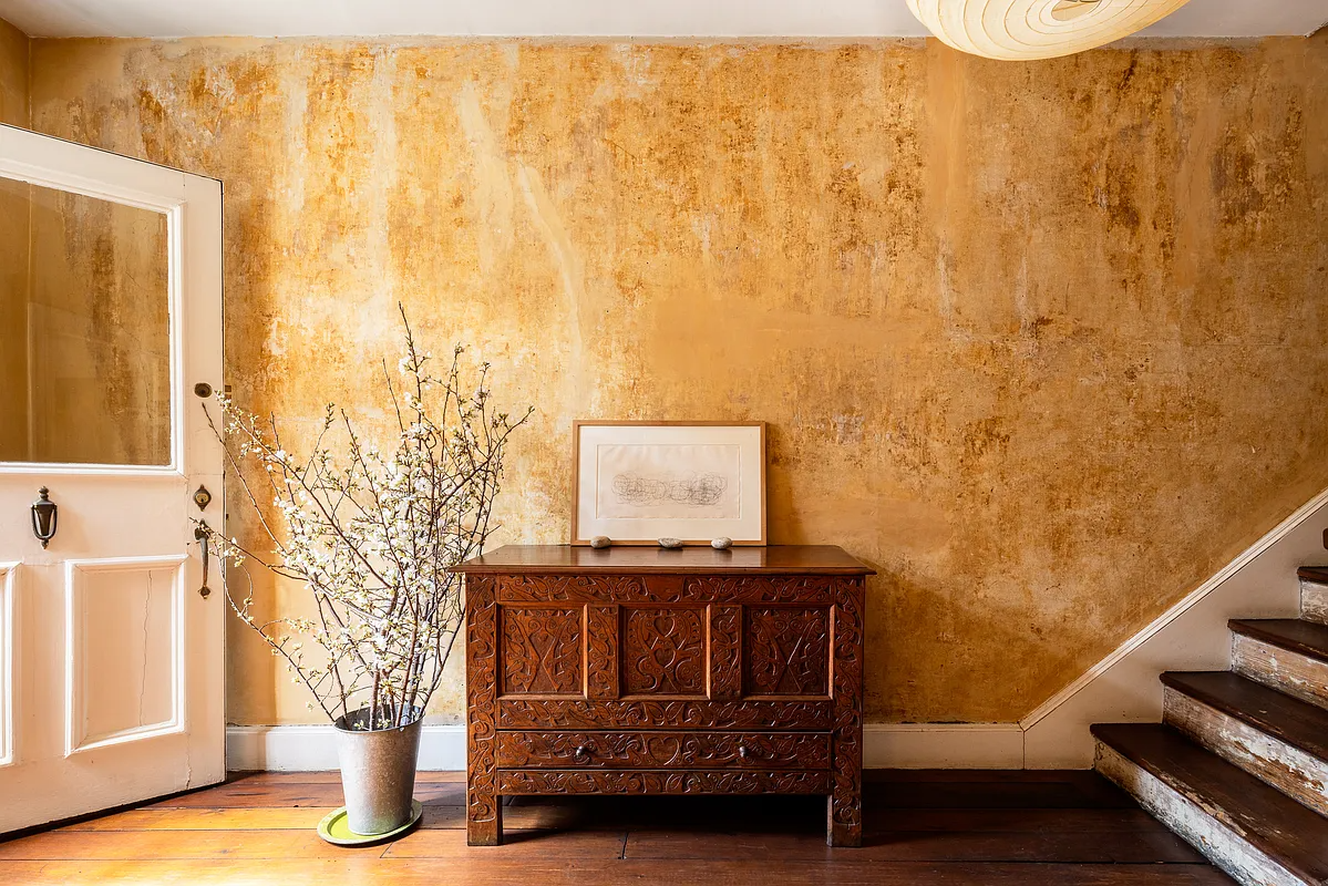 entry hall with textured walls, wood stair