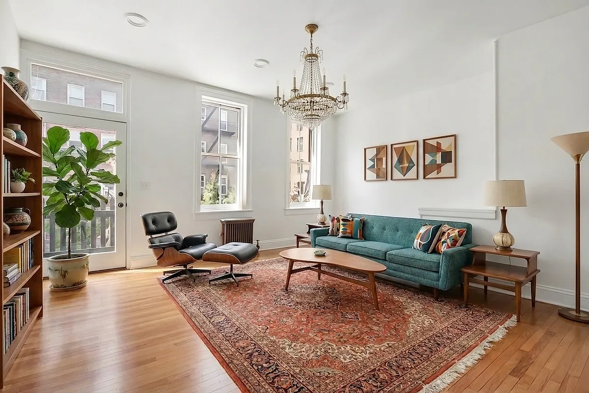 living room with white walls, wood floor