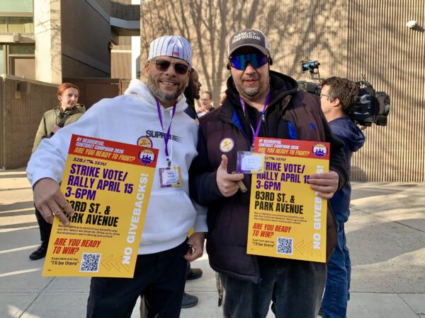 32BJ SEIU Strike Captains Edwin Devalle and Hasan “SunnyD” Dibra in front of 101 Clark Street in Brooklyn Heights. Photo: Mary Frost/Brooklyn Eagle