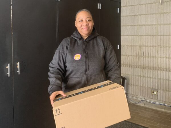 On Monday, Iecha Vega, a lobby attendant at 101 Clark St. in Brooklyn Heights, was sorting packages, one of her many duties. Photo: Mary Frost/Brooklyn Eagle