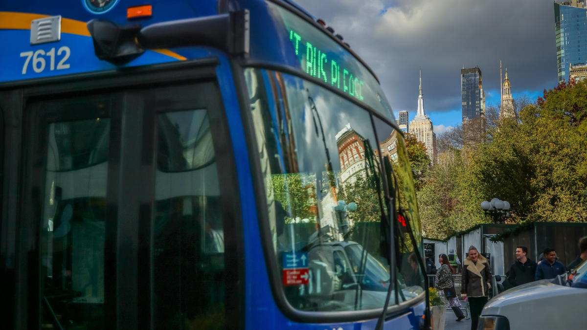 The Empire State Building behind an MTA bus in New York City