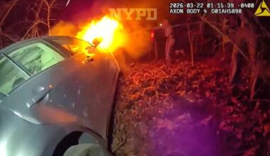 Police rescue three from burning car in Queens