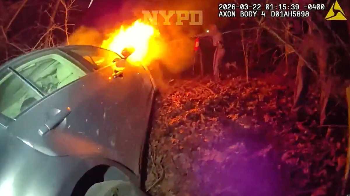 Police rescue three from burning car in Queens