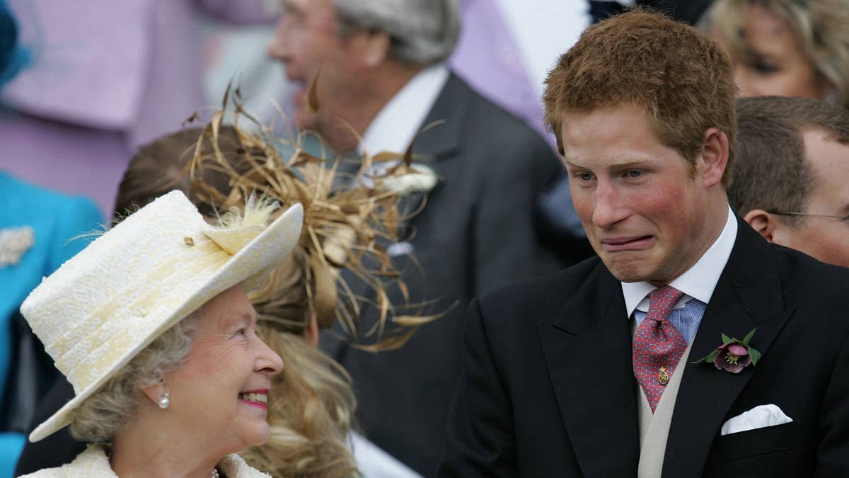 Britain's Queen Elizabeth II and Prince Harry share a joke as they watch Prince Charles and his bride Camilla Duchess of Cornwall leave St George's Chapel in Windsor following their marriage blessing, 09 April 2005. Prince Charles and his longtime sweetheart Camilla Parker Bowles married today after two months of muddled preparations and a lifetime of waiting. (Photo credit should read ALASTAIR GRANT/AFP via Getty Images)ALASTAIR GRANT&sol;AFP via Getty Images