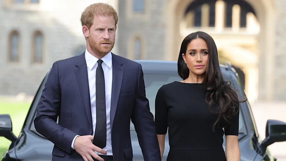 Prince Harry and Meghan, Duchess of Sussex arrive on the long Walk at Windsor Castle arrive to view flowers and tributes to HM Queen Elizabeth on September 10, 2022 