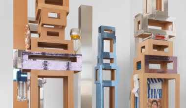 Isa Genzken, Untitled (4 Türme, 3 Stelen), 2015. Installation of 7 parts (4 towers, 3 columns), MDF, plastic, mirror foil, glass, cigarette, tin foil, spray paint, plaster, acrylic, adhesive tape, photographs, metal, aluminium, paper; dimensions variable, approx. 132 ⅘ × 141 ¾ × 118 inches. Courtesy the artist and Galerie Buchholz.