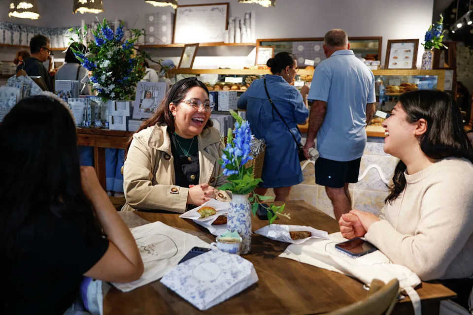 Dallas residents Jenny Lara, 29, (left) Jasmine Ortiz, 29, (center) and Anna Lara, 27, talk at Maman at its opening in November 2025. Lines wrapped around the shop in University Park. (Christine Vo/Staff Photographer)