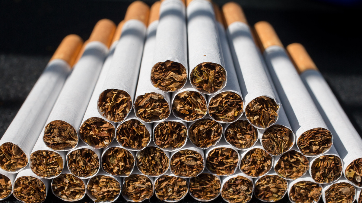 Close-up view of stacked cigarettes.