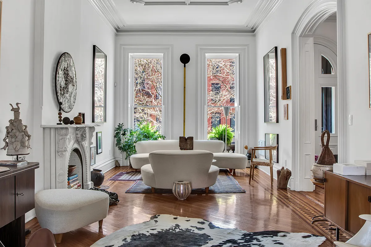 parlor with mantel, white molding and walls