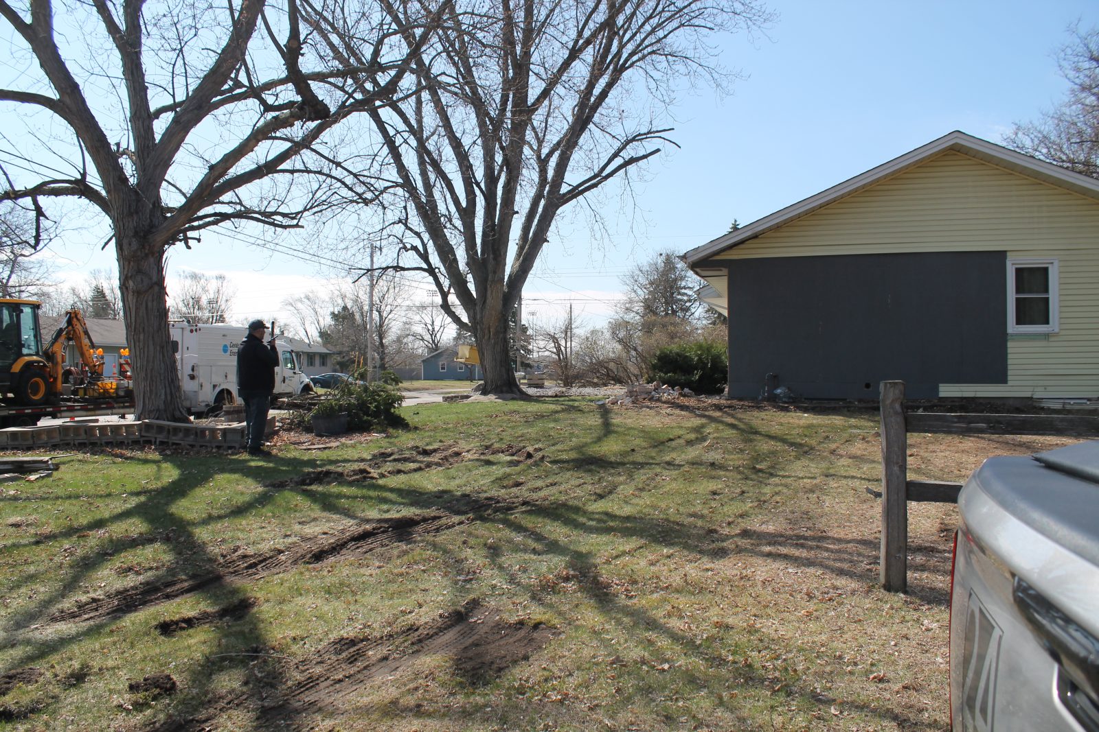 man looks at a housing repair