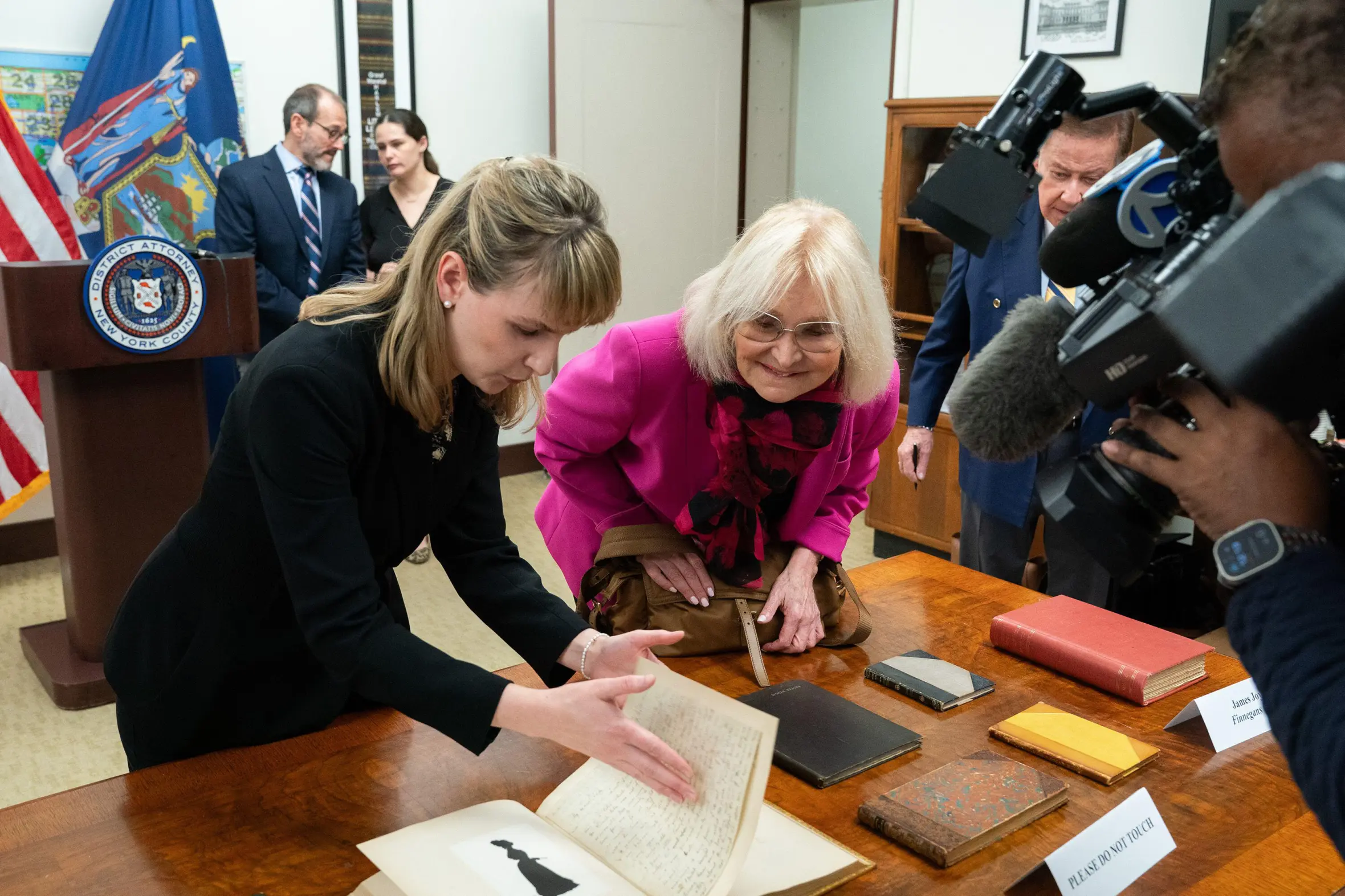 Antiquities trafficking analyst Hilary Chasse turns a page from a bound collection of 37 love letters written by John Keats to Fanny Brawne.