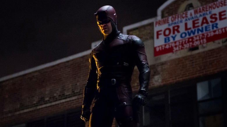 Matt Murdock wearing the Daredevil suit outside a warehouse in Daredevil