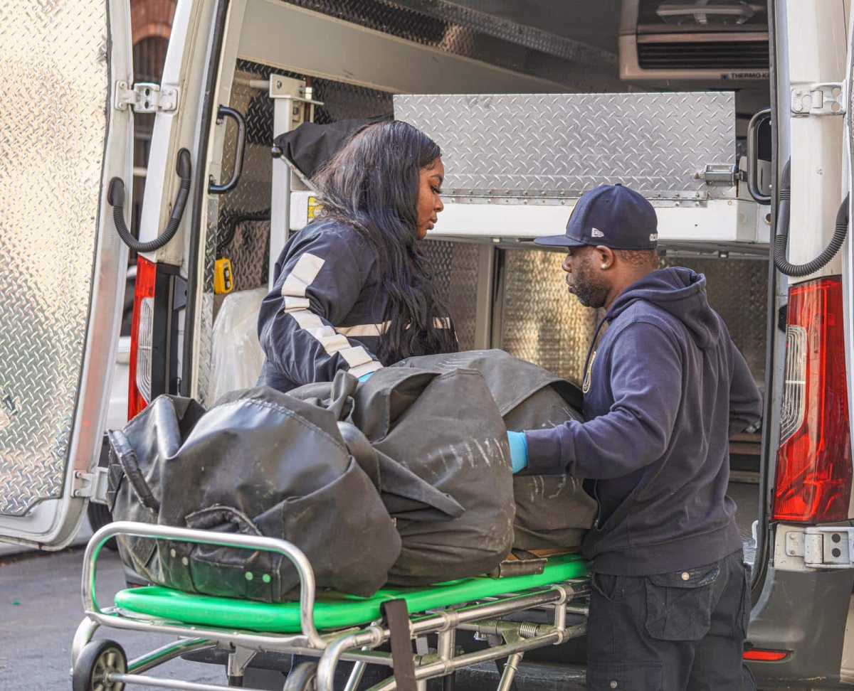 Manhattan medical examiner team loading human remains into van