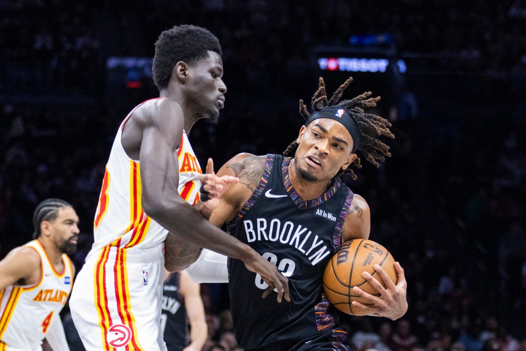 Nets center Nic Claxton (33) drives against Atlanta Hawks forward Mouhamed Gueye (18) during the first half at Barclays Center, Friday, April 3, 2026, in Brooklyn, NY. 