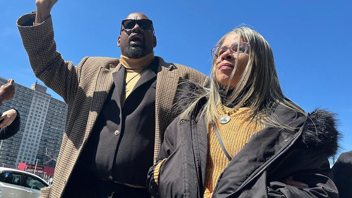 Gretchen Soto and Hawk Newsome standing outside Bronx County Hall of Justice