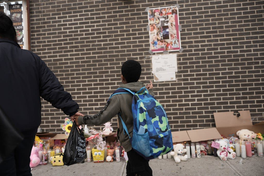 A memorial for Kaori has grown outside the Sem Sem Deli with candles, flowers and stuffed animals near the area where she was fatally struck by a stray bullet. James Keivom