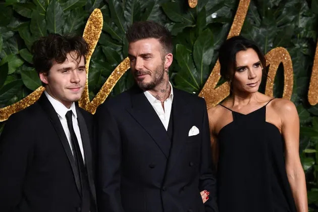 Brooklyn Beckham, David Beckham and Victoria Beckham in 2018. 