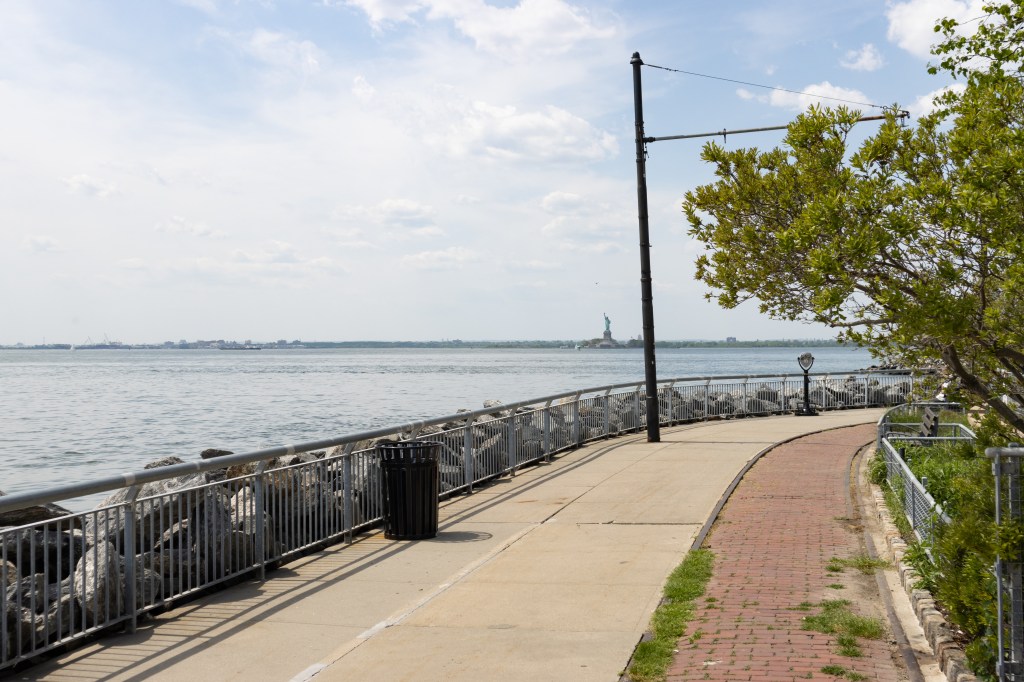 Empty Red Hook Brooklyn Waterfront with the Statue of Liberty in the Distance in New York City