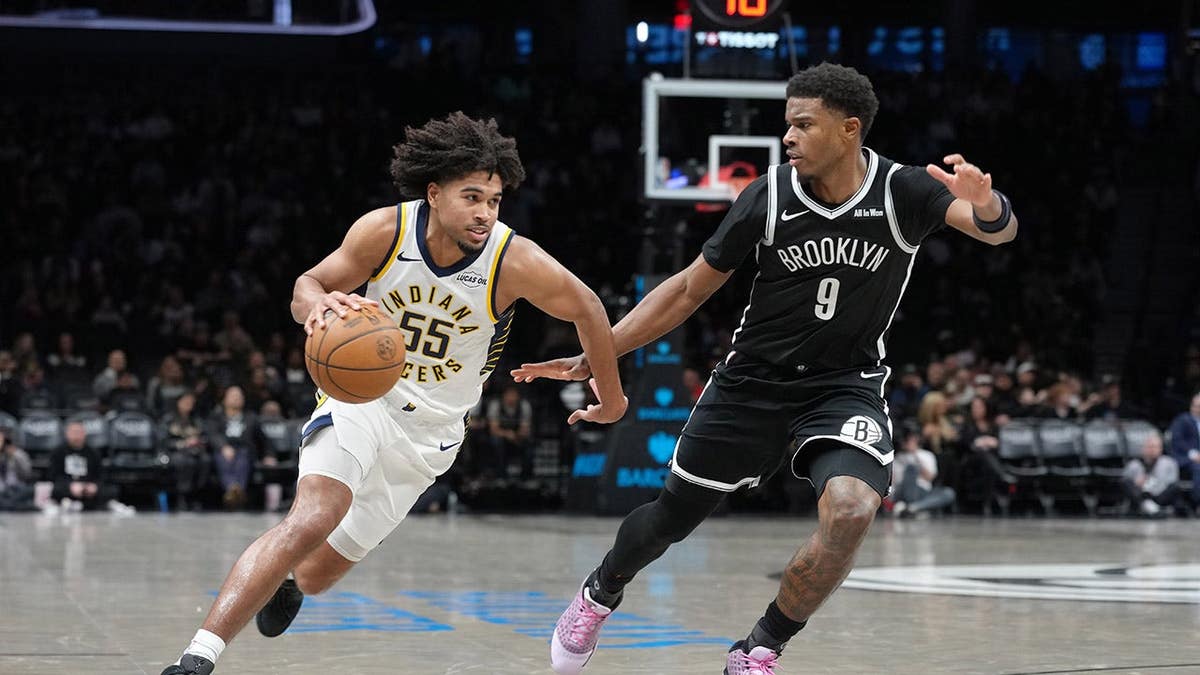 Indiana Pacers guard Ethan Thompson drives to the basket against Brooklyn Nets forward E.J. Liddell at Barclays Center
