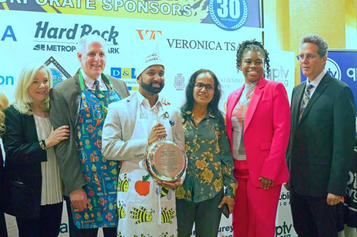 Honoree and officials of Queens Centers of Progress pose for a picture during the Fine Food event.