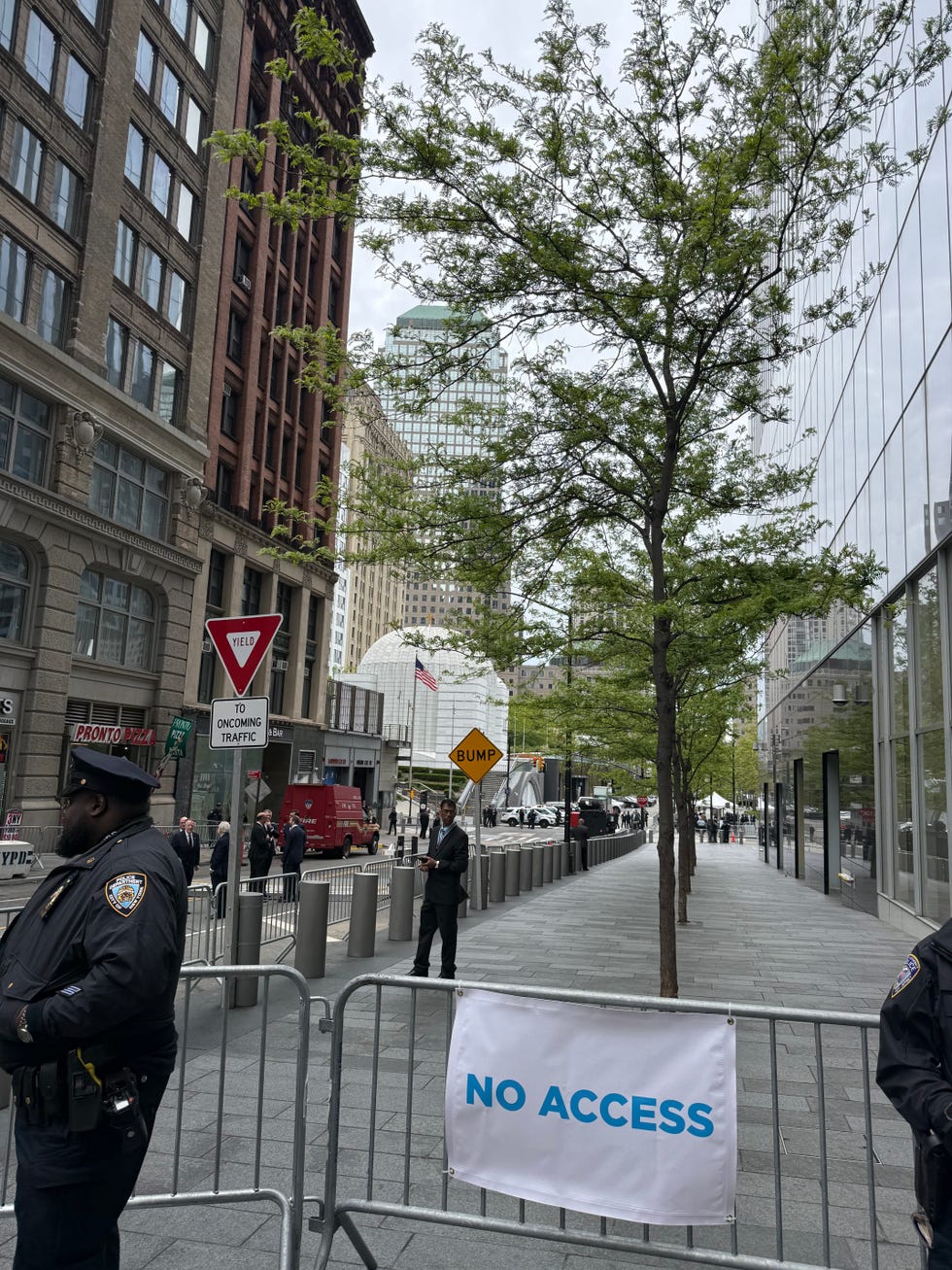Security presence and restricted access on a city street.