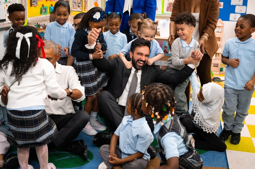 Preschoolers swarm former US president Barack Obama and Mayor Zohran Mamdani during their visit to Learning Through Play Pre-K in New York on Saturday. Photo: AP