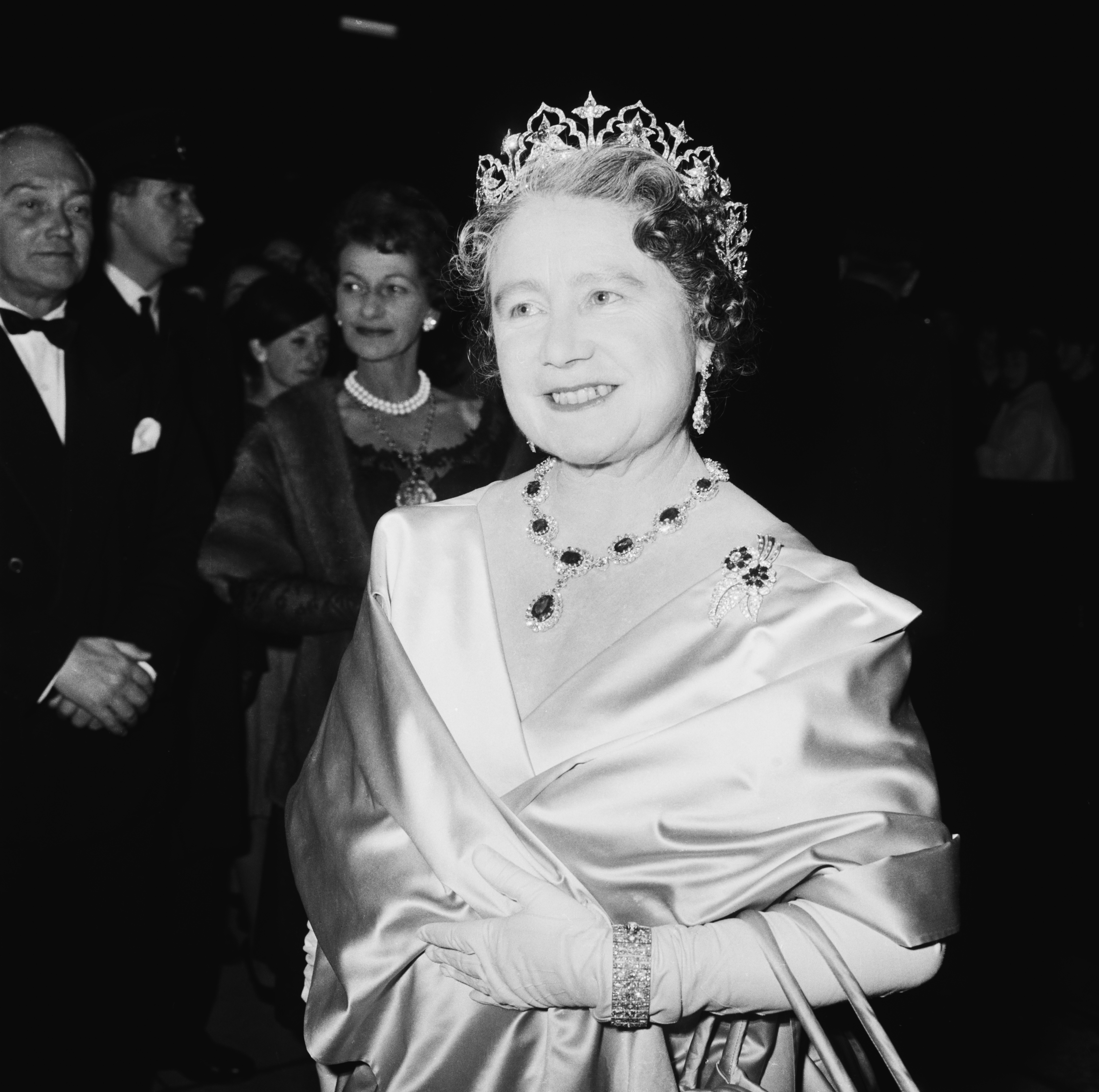 The Queen Mother (1900 - 2002) attends a performance at RADA (the Royal Academy of Dramatic Art), to celebrate the drama school&amp;apos;s Diamond Jubilee (60th anniversary), London, UK, November 1964. (Photo by Terry Disney/Express/Getty Images)