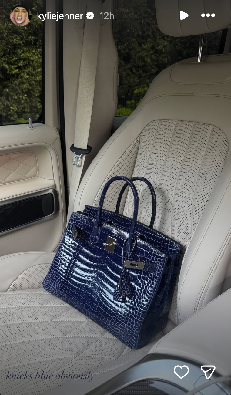 A handbag resting on a car seat. A handbag resting on a car seat.
