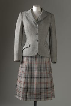 A women's Harris Tweed Jacket and kilt on a mannequin.