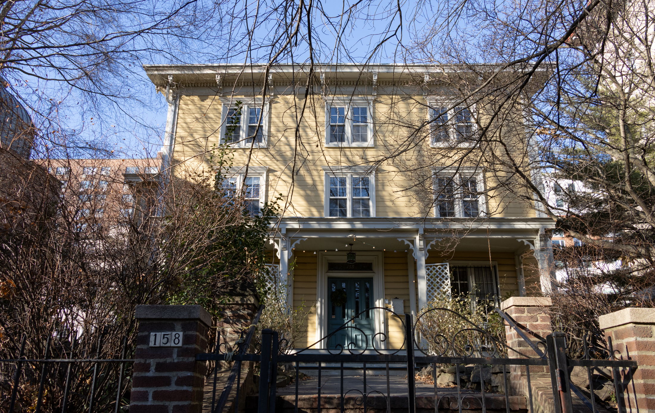 yellow wood frame house