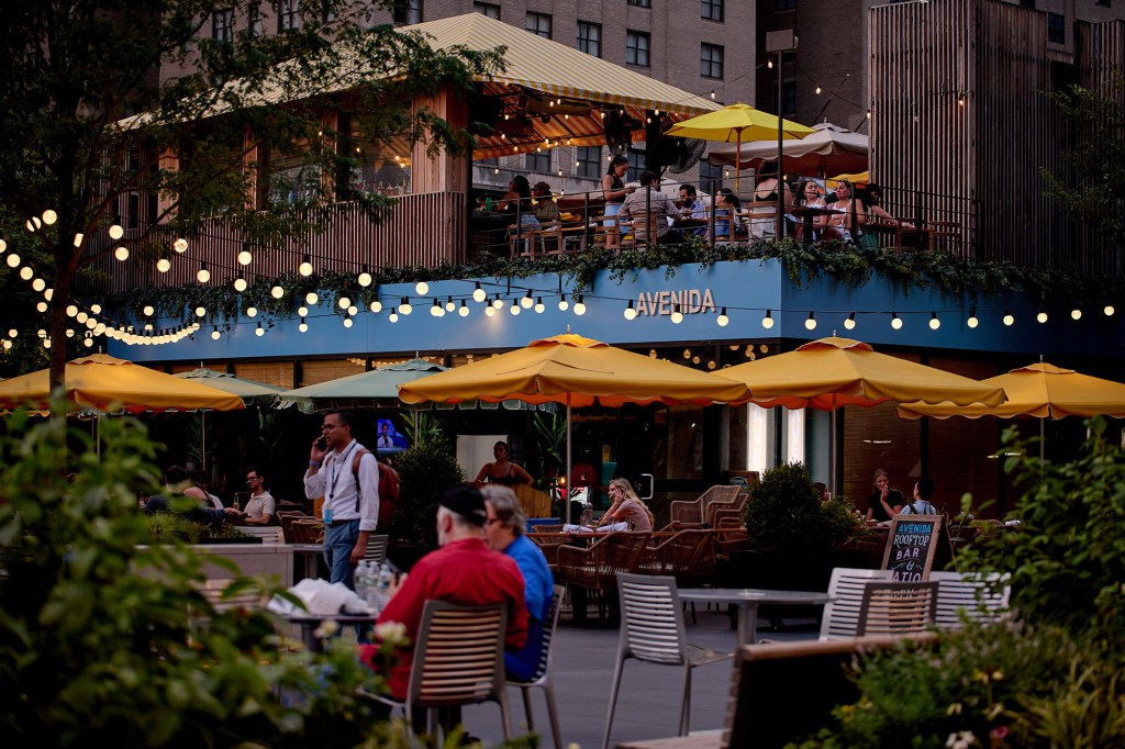 Customers at outdoor seating at a restaurant in New York.