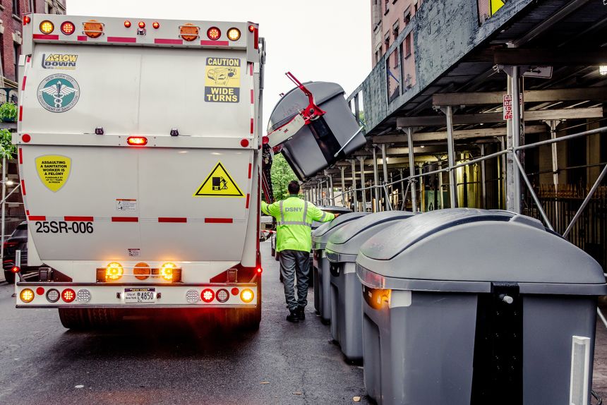 Large residential buildings in West Harlem are now required to put trash in large bins on the street instead of in piles on the curb.