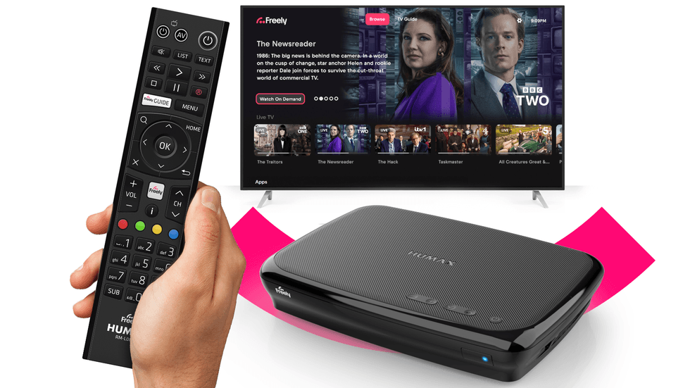 hand holding a remote control with the humax Aura EZ 4K TV Recorder with Freely pictured in the background