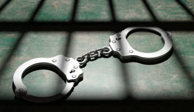 handcuffs on the floor of a jail cell