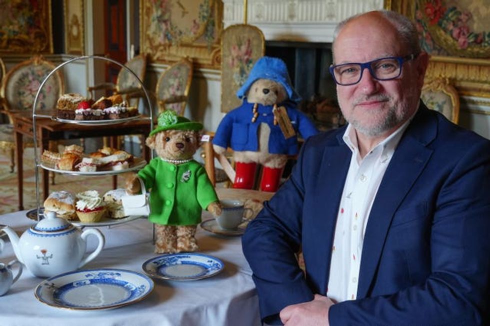Ian Munro in the foreground with a soft toy of Paddington and the special edition Queen Elizabeth II Steiff teddy bear