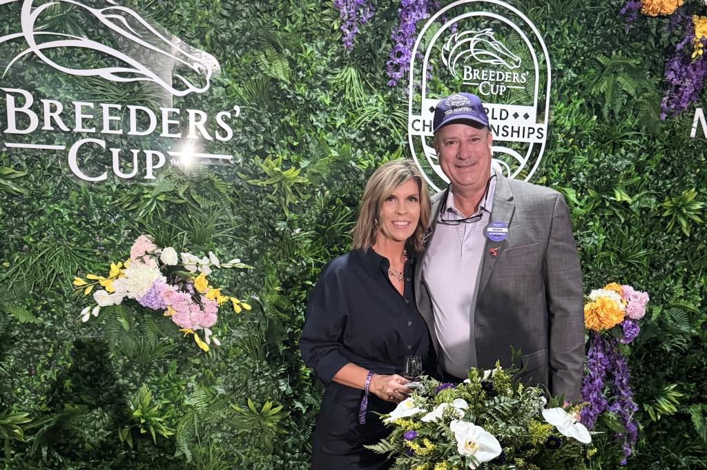 Thoroughbred trainer Mark Toothaker and his wife Malory pose at the Breeders' Cup in Lexington, Ky.