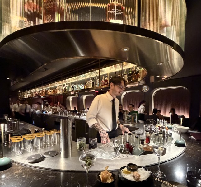 A bartender behind a sleek bar in Koreatown, Manhattan.