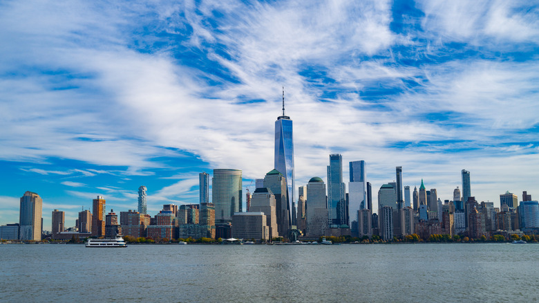 The NYC skyline against a beautiful blue sky.