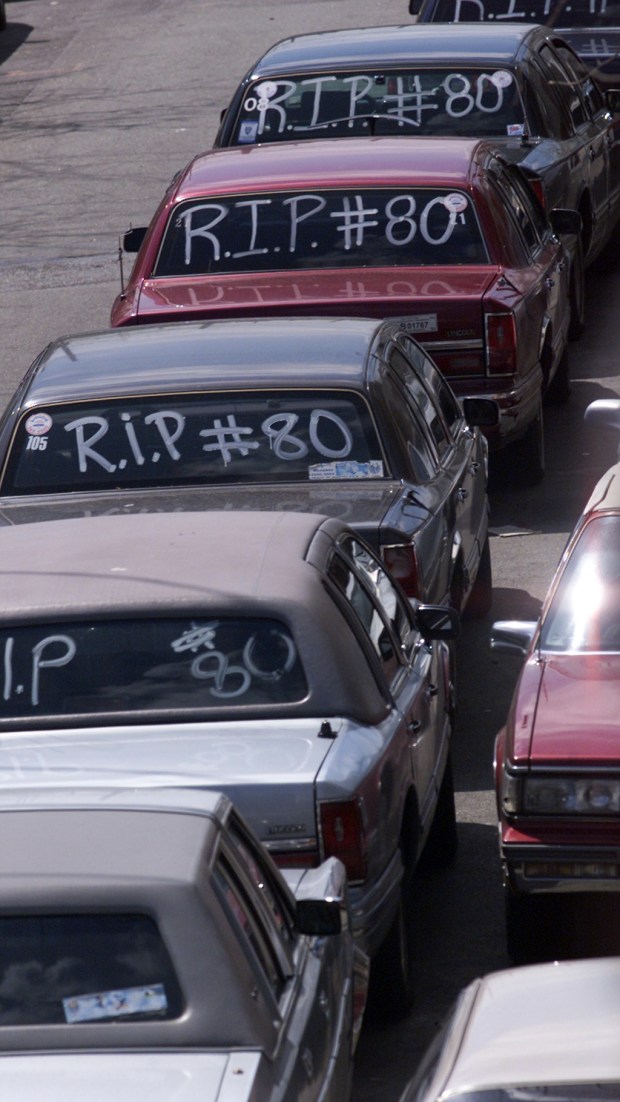 Livery cars line up for a procession outside St. Malagia Church in Brooklyn, where Cesar Manuel Lopez's funeral was held on May 2, 2000. (Mike Albans / New York Daily News)
