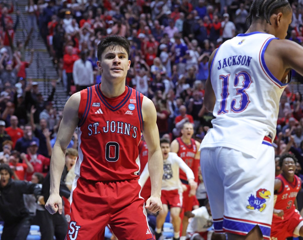 St. John's Red Storm guard Dylan Darling, number 0, reacts after winning the NCAA Tournament game against the Kansas Jayhawks.