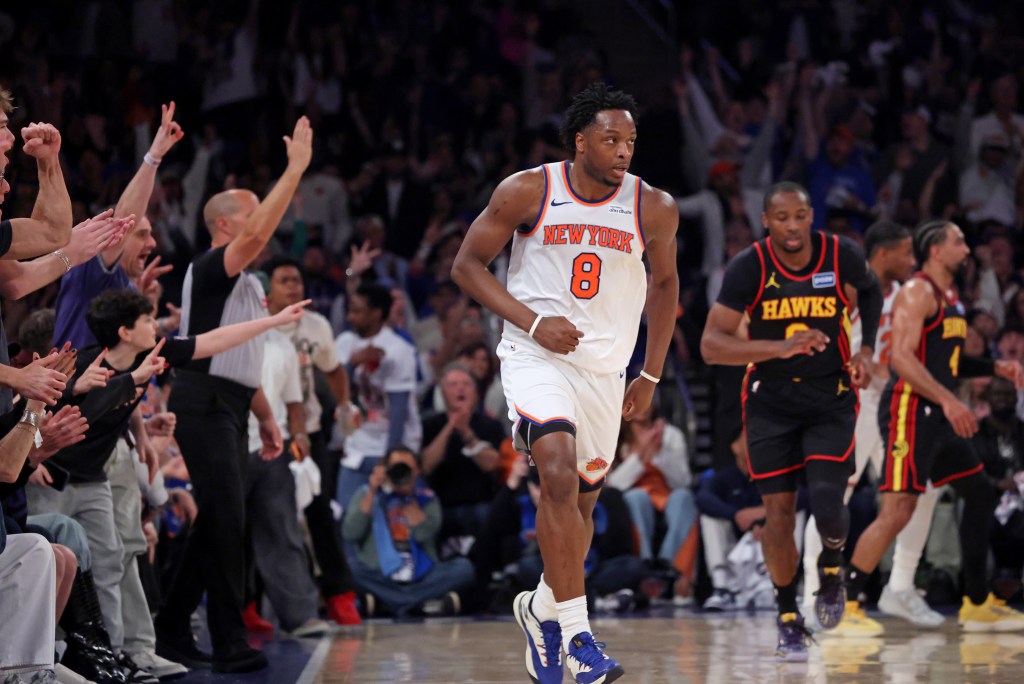 New York Knicks player Og Anunoby #8 reacts after a three-point shot in a game against the Atlanta Hawks at Madison Square Garden.