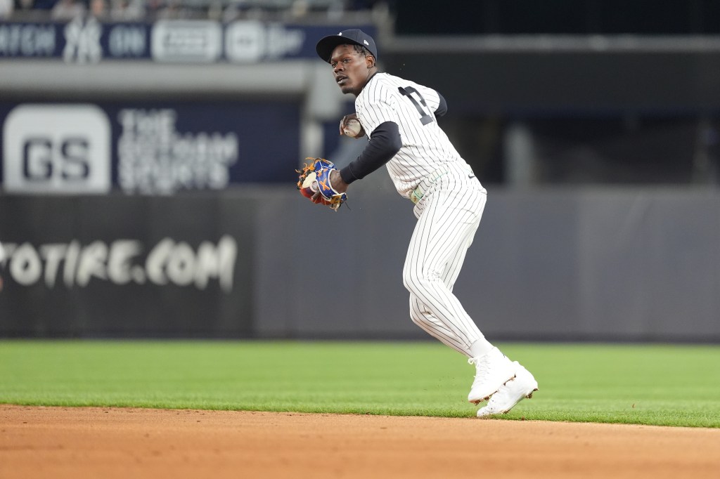 New York Yankees second baseman Jazz Chisholm Jr. (13) throws a baseball during the sixth inning at Yankee Stadium.