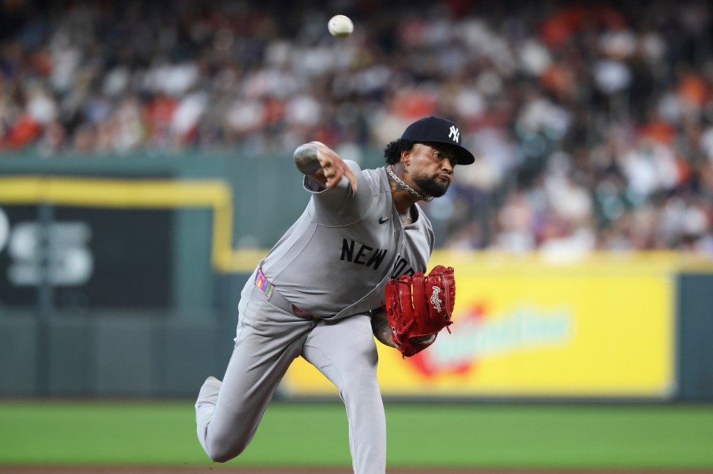 Yankees starting pitcher Luis Gil (81) delivers a pitch during the second inning against the Houston Astros at Daikin Park. 