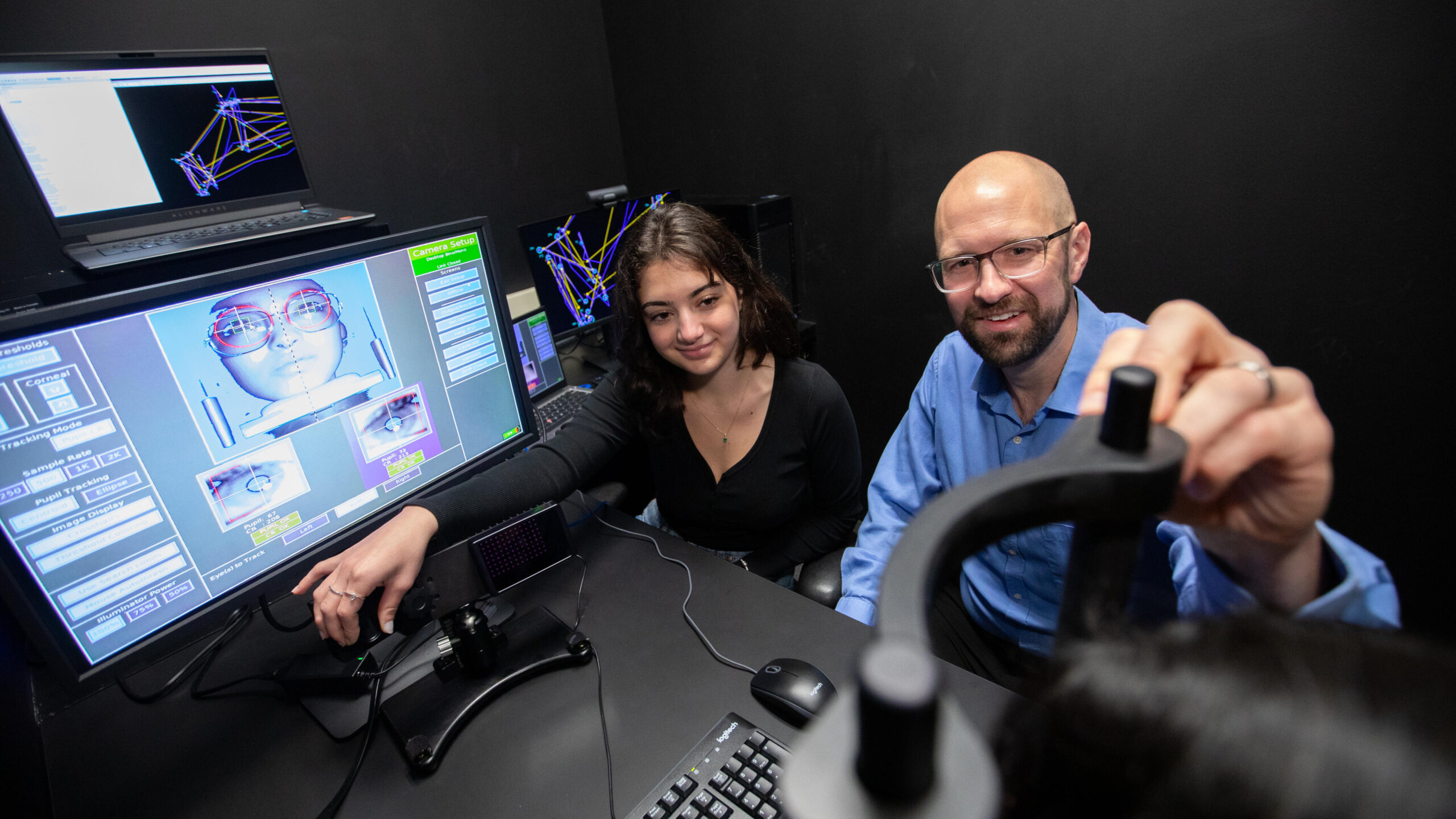 Talia Lilikakis and Robert Alexander working at a computer