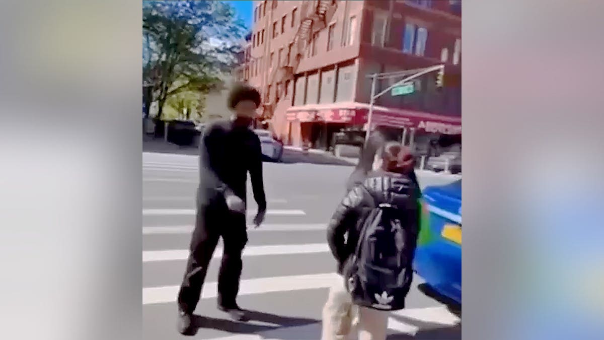 Boy confronting girl on street