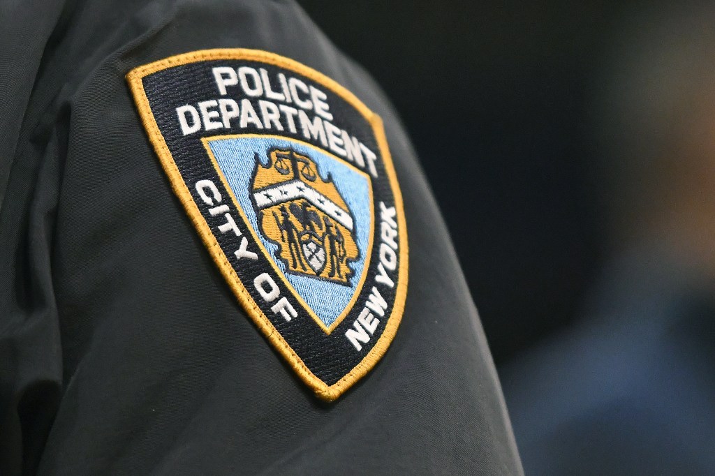 Close-up of a New York City Police Department patch on the sleeve of a uniform.