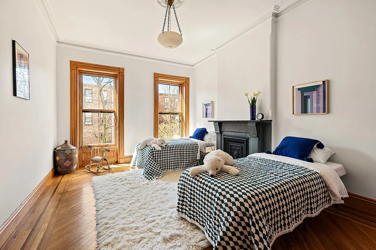 bedroom with stone mantel, room for two beds